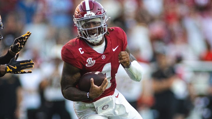 Oct 26, 2024; Tuscaloosa, Alabama, USA; Alabama Crimson Tide quarterback Jalen Milroe (4) carries the ball against Missouri Tigers safety Sidney Williams (3) during the third quarter at Bryant-Denny Stadium. Mandatory Credit: Will McLelland-Imagn Images