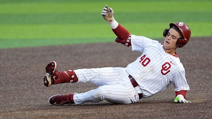 Oklahoma's Sam Christiansen (40) slides into second for a double during the college baseball game between the University of Oklahoma Sooners and the LSU Tigers at L. Dale Mitchell Park in Norman, Okla., Thursday, April, 3, 2025.