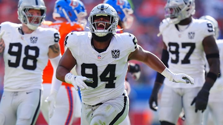 Oct 6, 2024; Denver, Colorado, USA; Las Vegas Raiders defensive tackle Christian Wilkins (94) celebrates his sack in the second quarter against the Denver Broncos at Empower Field at Mile High. Mandatory Credit: Ron Chenoy-Imagn Images