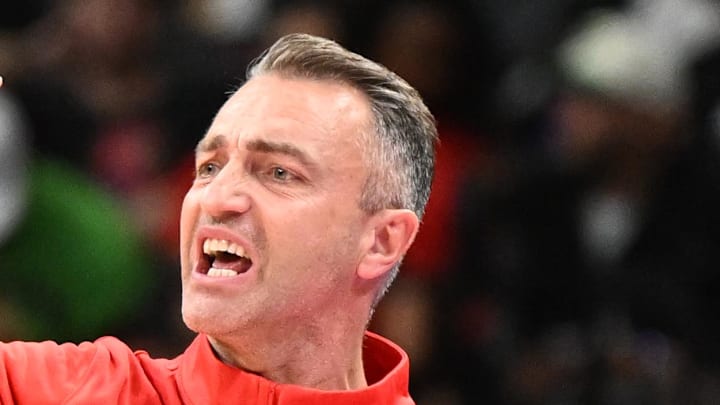 Toronto Raptors head coach Darko Rajakovic gestures as he speaks to his players in the second half against the Boston Celtics