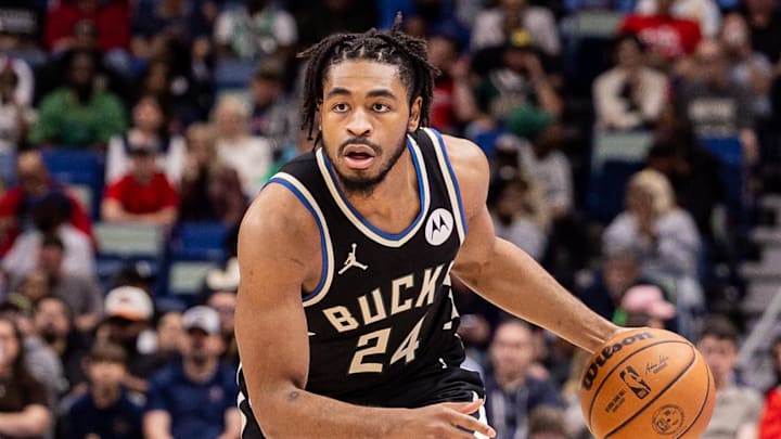 Milwaukee Bucks guard Cam Thomas (24) dribbles against New Orleans Pelicans forward Zion Williamson (1) during the first half at Smoothie King Center. Feb 20, 2026.