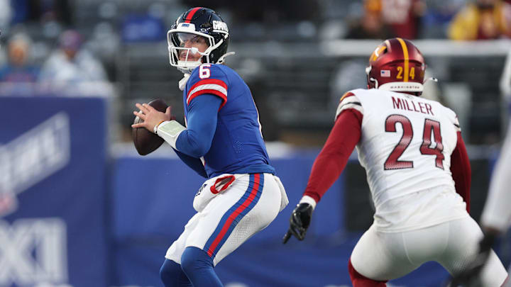 Dec 14, 2025; East Rutherford, New Jersey, USA;  New York Giants quarterback Jaxson Dart (6) looks to pass during the fourth quarter against the Washington Commanders at MetLife Stadium. Mandatory Credit: Vincent Carchietta-Imagn Images