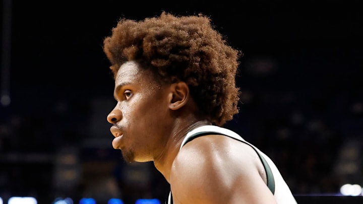 Michigan State's Coen Carr peers over at the Louisville defense during the second round of the NCAA Tournament at the KeyBank Center on Saturday, March 21, 2026. Michigan State's Coen Carr peers over at the Louisville defense during the second round of the NCAA Tournament at the KeyBank Center on Saturday, March 21, 2026.