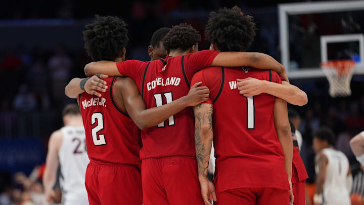 Mar 12, 2026; Charlotte, NC, USA;  NC State Wolfpack players react to the loss during the second half against the Virginia Cavaliers at Spectrum Center. Mandatory Credit: Jim Dedmon-Imagn Images