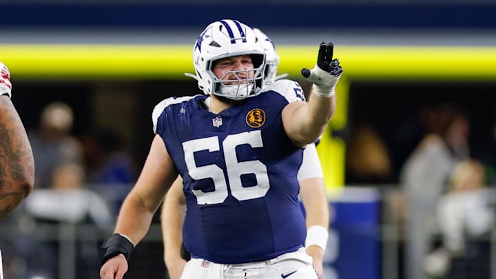 Dallas Cowboys center Cooper Beebe signals at the line against the New York Giants.