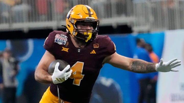 Arizona State running back Cam Skattebo (4) runs against Texas defensive back Jelani McDonald (25) during the third quarter of the Chick-fil-A Peach Bowl in Atlanta on Jan. 1, 2025. Arizona State running back Cam Skattebo (4) runs against Texas defensive back Jelani McDonald (25) during the third quarter of the Chick-fil-A Peach Bowl in Atlanta on Jan. 1, 2025.