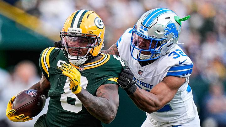 Detroit Lions safety Brian Branch (32) tackles Green Bay Packers running back Josh Jacobs (8) during the second half at Lambeau Field in Green Bay, Wis., on Sunday, September 7, 2025.