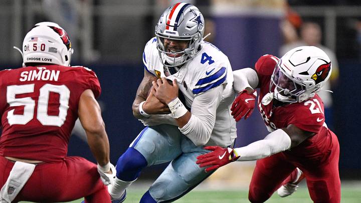 Dallas Cowboys QB Dak Prescott runs against Arizona Cardinals CB Garrett Williams and LB Cody Simon. Dallas Cowboys QB Dak Prescott runs against Arizona Cardinals CB Garrett Williams and LB Cody Simon.