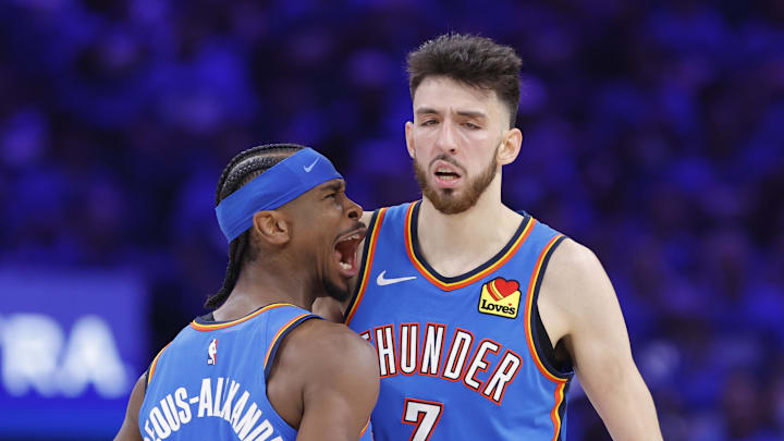 May 22, 2025; Oklahoma City, Oklahoma, USA; Oklahoma City Thunder guard Shai Gilgeous-Alexander (2) and forward Chet Holmgren (7) celebrate after a play against the Minnesota Timberwolves in the third quarter during game two of the western conference finals for the 2025 NBA Playoffs at Paycom Center. Mandatory Credit: Alonzo Adams-Imagn Images