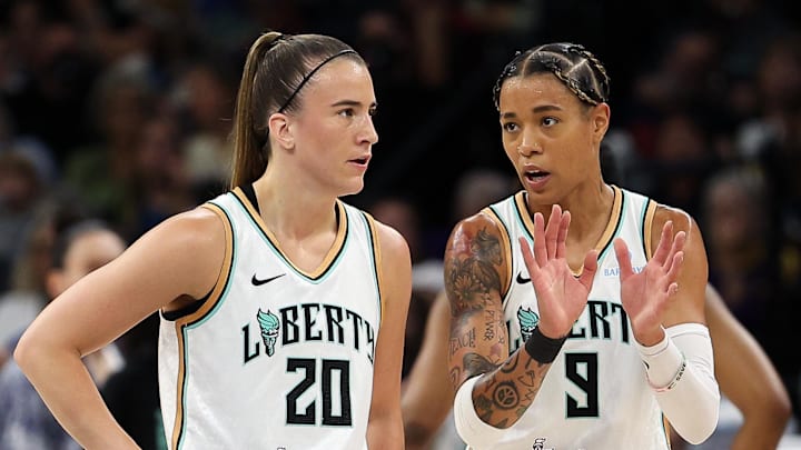 Aug 16, 2025; Minneapolis, Minnesota, USA; New York Liberty guard Natasha Cloud (9) talks with guard Sabrina Ionescu (20) during the third quarter against the Minnesota Lynx at Target Center. Mandatory Credit: Matt Krohn-Imagn Images