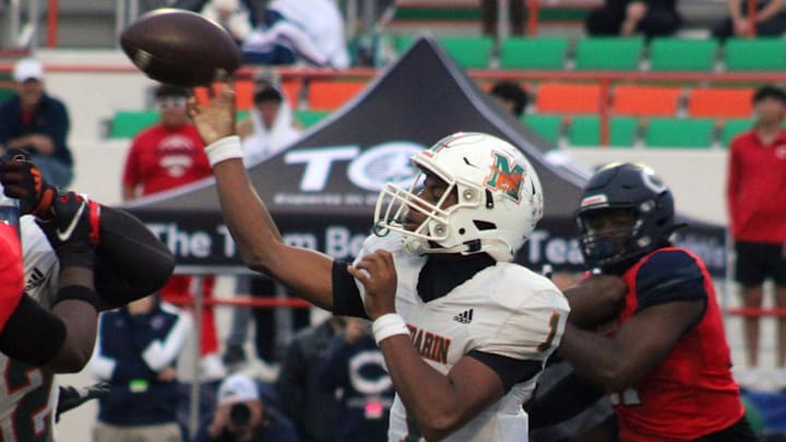 Mandarin quarterback Tramell Jones (1) throws downfield as Miami Columbus edge rushers Dylan Stephenson (2) and Willis McGahee IV (17) close in during the FHSAA Class 4M high school football championship game on December 8, 2023. [Clayton Freeman/Florida Times-Union]