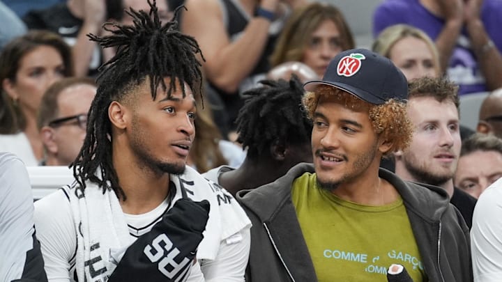 Nov 7, 2024; San Antonio, Texas, USA;  San Antonio Spurs center Victor Wembanyama (1), guard Stephon Castle (5), forward Jeremy Sochan (10) and guard Tre Jones (33) on the bench in the second half against the Portland Trail Blazers at Frost Bank Center. Mandatory Credit: Daniel Dunn-Imagn Images