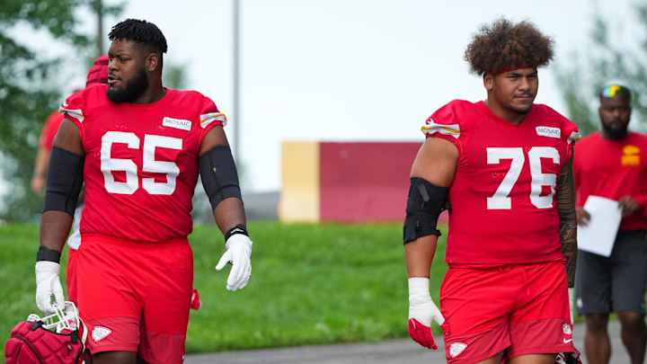 Jul 22, 2025; St. Joseph, MO, USA; Kansas City Chiefs guard Trey Smith (65) and offensive tackle Kingsley Suamataia (76) walk down the hill to the practice fields during training camp at Missouri Western State University. Mandatory Credit: Denny Medley-Imagn Images