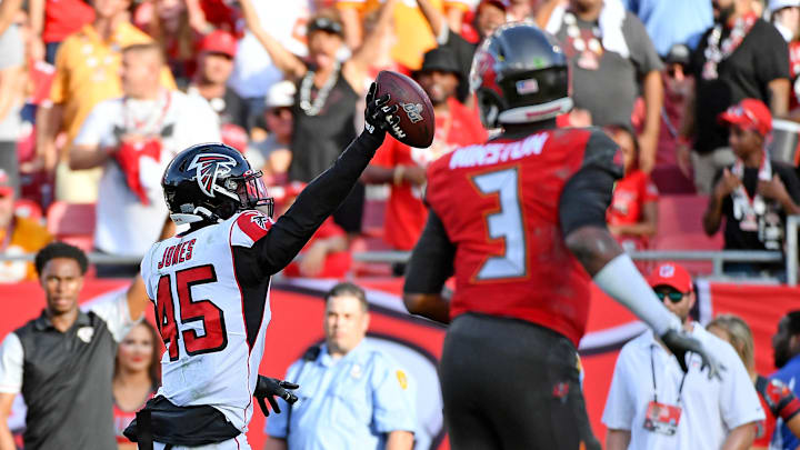Dec 29, 2019; Tampa, Florida, USA; Atlanta Falcons linebacker Deion Jones (45) runs back an interception from Tampa Bay Buccaneers quarterback Jameis Winston (3) for the game winning touchdown during overtime against the Tampa Bay Buccaneers at Raymond James Stadium. Mandatory Credit: Jasen Vinlove-Imagn Images
