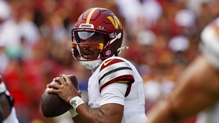 Sep 7, 2025; Landover, Maryland, USA; Washington Commanders quarterback Jayden Daniels (5) drops back to pass during the first quarter against the New York Giants at Northwest Stadium. Mandatory Credit: Peter Casey-Imagn Images