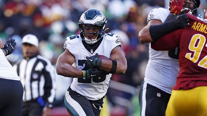 Dec 22, 2024; Landover, Maryland, USA; Philadelphia Eagles running back Saquon Barkley (26) runs the ball against the Washington Commanders during the third quarter at Northwest Stadium. Mandatory Credit: Peter Casey-Imagn Images