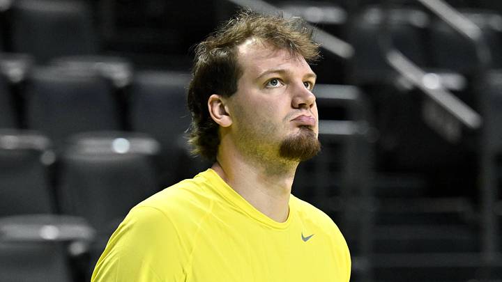 Feb 25, 2026; Eugene, Oregon, USA; Oregon Ducks center Nate Bittle (32) warms up on the court before the game against the Wisconsin Badgers at Matthew Knight Arena. 
