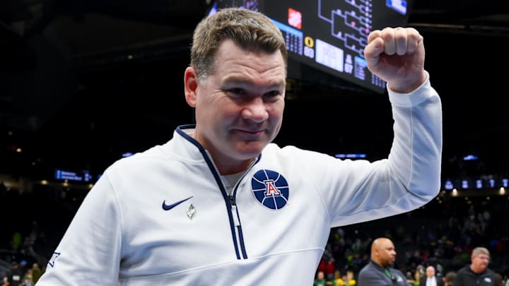 Mar 23, 2025; Seattle, WA, USA; Arizona Wildcats head coach Tommy Lloyd celebrates after defeating the Oregon Ducks at Climate Pledge Arena. Mandatory Credit: Stephen Brashear-Imagn Images Mar 23, 2025; Seattle, WA, USA; Arizona Wildcats head coach Tommy Lloyd celebrates after defeating the Oregon Ducks at Climate Pledge Arena. Mandatory Credit: Stephen Brashear-Imagn Images