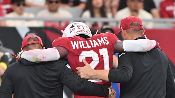 Sep 14, 2025; Glendale, Arizona, USA;  Arizona Cardinals cornerback Garrett Williams (21) is taken off the field by medical during the fourth quarter against the Indianapolis Colts at State Farm Stadium. Mandatory Credit: Matt Kartozian-Imagn Images
