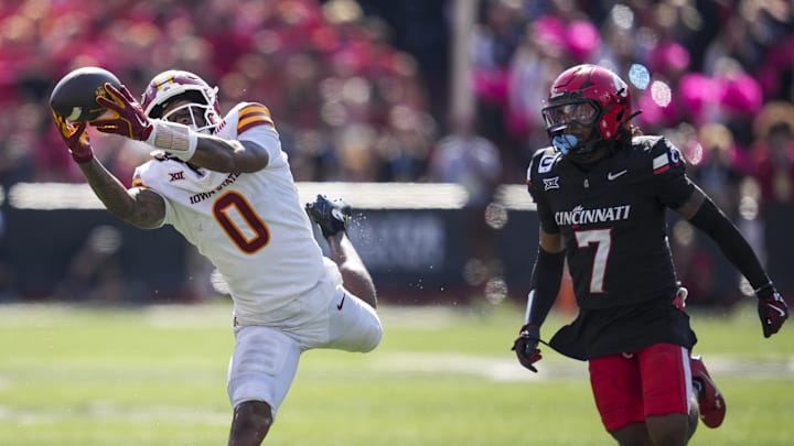 Oct 4, 2025; Cincinnati, Ohio, USA;  Iowa State Cyclones wide receiver Chase Sowell (0) makes a catch against Cincinnati Bearcats cornerback Logan Wilson (7) in the second half at Nippert Stadium. 