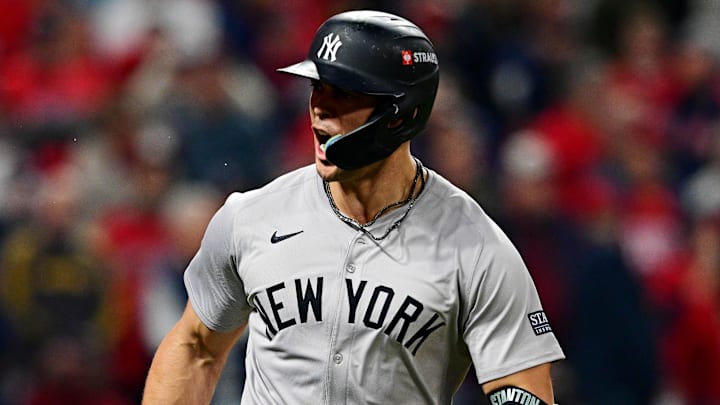 Oct 19, 2024; Cleveland, Ohio, USA; New York Yankees designated hitter Giancarlo Stanton (27) celebrates after hitting a two run home run during the sixth inning against the Cleveland Guardians during game five of the ALCS for the 2024 MLB playoffs at Progressive Field. Mandatory Credit: David Dermer-Imagn Images Oct 19, 2024; Cleveland, Ohio, USA; New York Yankees designated hitter Giancarlo Stanton (27) celebrates after hitting a two run home run during the sixth inning against the Cleveland Guardians during game five of the ALCS for the 2024 MLB playoffs at Progressive Field. Mandatory Credit: David Dermer-Imagn Images