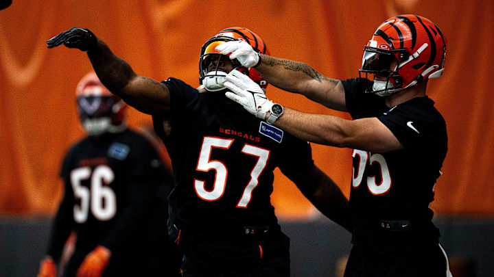 Cincinnati Bengals linebacker Germaine Pratt (57) strips Cincinnati Bengals linebacker Logan Wilson (55) of the ball during a drill at Bengals spring practice at the IEL Indoor Facility in Cincinnati on Wednesday, June 12, 2024.