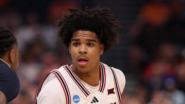 Mar 20, 2026; Tampa, FL, USA; Texas Tech Red Raiders guard Christian Anderson (4) dribbles against Akron Zips guard Evan Mahaffey (12) in the first half during a first round game of the men's 2026 NCAA Tournament at Benchmark International Arena. Mandatory Credit: Matt Pendleton-Imagn Images
