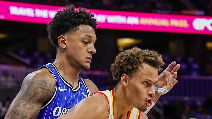 Orlando Magic forward Paolo Banchero defends Atlanta Hawks guard Dyson Daniels. Orlando Magic forward Paolo Banchero defends Atlanta Hawks guard Dyson Daniels.