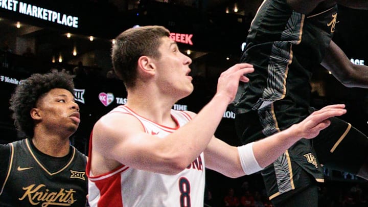 Mar 12, 2026; Kansas City, MO, USA; UCF Knights center John Bol (7) and Arizona Wildcats center Motiejus Krivas (13) rebound during the second half at T-Mobile Center. Mandatory Credit: William Purnell-Imagn Images Mar 12, 2026; Kansas City, MO, USA; UCF Knights center John Bol (7) and Arizona Wildcats center Motiejus Krivas (13) rebound during the second half at T-Mobile Center. Mandatory Credit: William Purnell-Imagn Images