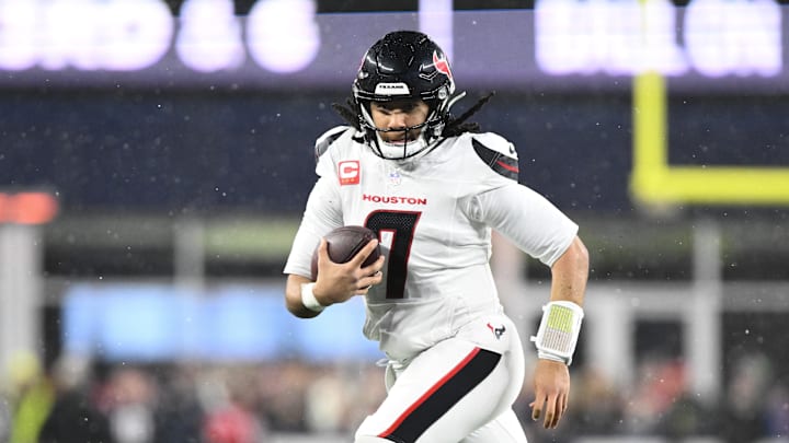 Jan 18, 2026; Foxborough, MA, USA; Houston Texans quarterback C.J. Stroud (7) runs with the ball in the third quarter against the New England Patriots in an AFC Divisional Round game at Gillette Stadium. Mandatory Credit: Brian Fluharty-Imagn Images