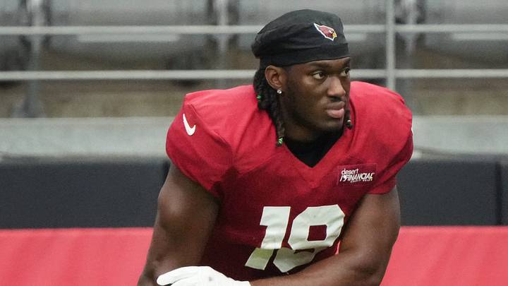 Arizona Cardinals receiver Marvin Harrison Jr. (18) watches from the sidelines during the team's practice at State Farm Stadium on July 29, 2025. Arizona Cardinals receiver Marvin Harrison Jr. (18) watches from the sidelines during the team's practice at State Farm Stadium on July 29, 2025.