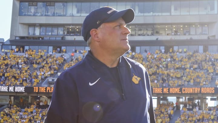 Aug 30, 2025; Morgantown, West Virginia, USA; West Virginia Mountaineers head coach Rich Rodriguez sings “Country Roads” after defeating the Robert Morris Colonials at Milan Puskar Stadium. Mandatory Credit: Ben Queen-Imagn Images