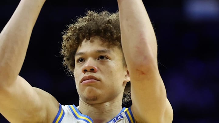 Mar 20, 2026; Philadelphia, PA, USA; UCLA Bruins guard Trent Perry (0) shoots the ball in the second half during a first round game of the men's 2026 NCAA Tournament at Xfinity Mobile Arena. Mandatory Credit: Bill Streicher-Imagn Images