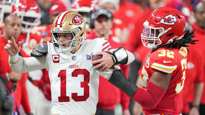 San Francisco 49ers quarterback Brock Purdy (13) and Kansas City Chiefs linebacker Nick Bolton (32)