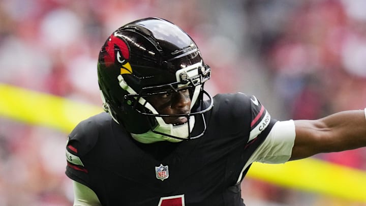 Arizona Cardinals receiver Greg Dortch (4) tries to stiff arm San Francisco 49ers linebacker Dee Winters (53) at State Farm Stadium in Glendale on Nov. 16, 2025. Arizona Cardinals receiver Greg Dortch (4) tries to stiff arm San Francisco 49ers linebacker Dee Winters (53) at State Farm Stadium in Glendale on Nov. 16, 2025.