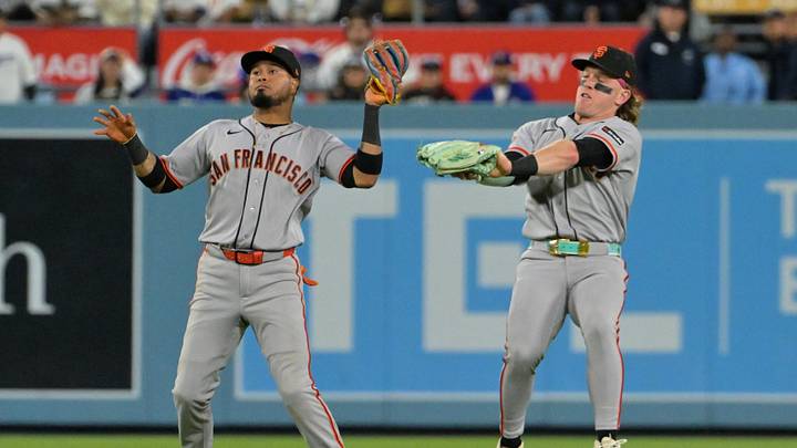 May 12, 2026; Los Angeles, California, USA; San Francisco Giants second baseman Luis Arraez (1) catches a fly ball next to center fielder Harrison Bader (9) hit by Los Angeles Dodgers catcher Will Smith (not pictured) during the sixth inning at Dodger Stadium. Mandatory Credit: Jayne Kamin-Oncea-Imagn Images