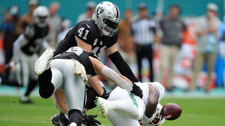 Nov 19, 2023; Miami Gardens, Florida, USA; Las Vegas Raiders linebacker Luke Masterson (59) forces Miami Dolphins quarterback Tua Tagovailoa (1) to fumble the ball during the first half at Hard Rock Stadium. Mandatory Credit: Jasen Vinlove-Imagn Images