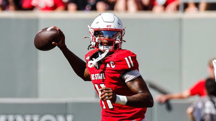 Oct 4, 2025; Raleigh, North Carolina, USA; NC State Wolfpack quarterback CJ Bailey (11) prepares to throw the ball during the first half of the game against Campbell Fighting Camels at Carter-Finley Stadium. Mandatory Credit: Jaylynn Nash-Imagn Images