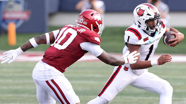Sep 6, 2025; Little Rock, Arkansas, USA; Arkansas State Red Wolves quarterback Jaylen Raynor (1) rushes during the first quarter against the Arkansas Razorbacks at War Memorial Stadium.