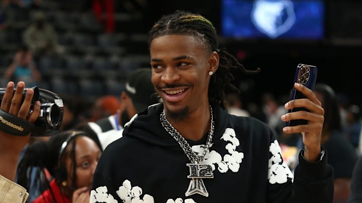 Nov 17, 2024; Memphis, Tennessee, USA; Memphis Grizzlies guard Ja Morant (12) takes videos with his phone after the game against the Denver Nuggets at FedExForum. Mandatory Credit: Petre Thomas-Imagn Images Nov 17, 2024; Memphis, Tennessee, USA; Memphis Grizzlies guard Ja Morant (12) takes videos with his phone after the game against the Denver Nuggets at FedExForum. Mandatory Credit: Petre Thomas-Imagn Images