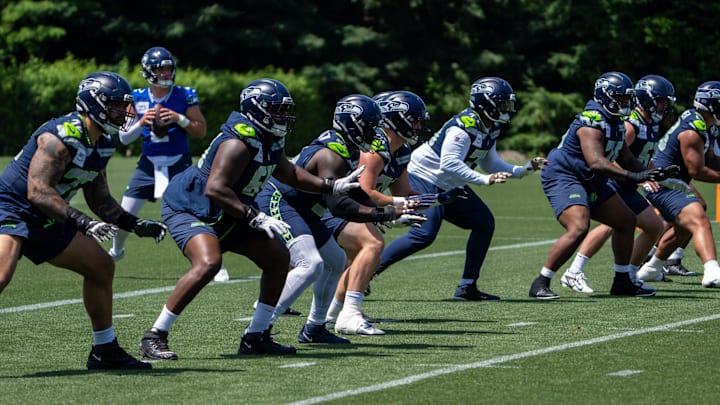 Jun 11, 2025; Renton, WA, USA; Seattle Seahawks offensive line units take part in drills during mini-camp at Virginia Mason Athletic Center. Mandatory Credit: Stephen Brashear-Imagn Images