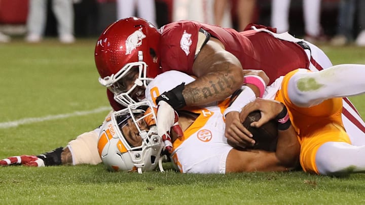 Arkansas Razorbacks defensive lineman Cameron Ball (5) sacks Tennessee Volunteers quarterback Nico Iamaleava (8) during the second quarter at Razorback Stadium on Oct. 5.