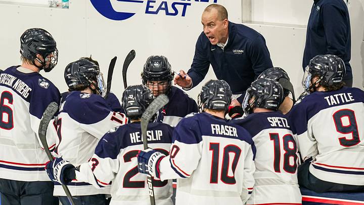 Feb 25, 2025; Storrs, CT, USA; UConn head coach Mike Cavanaugh talks to his team from the bench as they take on Boston University at Toscano Family Ice Forum. Feb 25, 2025; Storrs, CT, USA; UConn head coach Mike Cavanaugh talks to his team from the bench as they take on Boston University at Toscano Family Ice Forum.