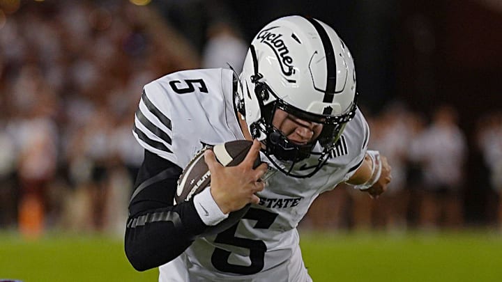 Iowa State Cyclones' quarterback  (5) breaks a tackle from Arizona Wildcats defensive back Marquis Groves-Killebrew (5) and runs for first down during the fourth quarter in the Big-12 conference showdown on Sept. 27, 2025, at Jack Trice Stadium in Ames, Iowa.