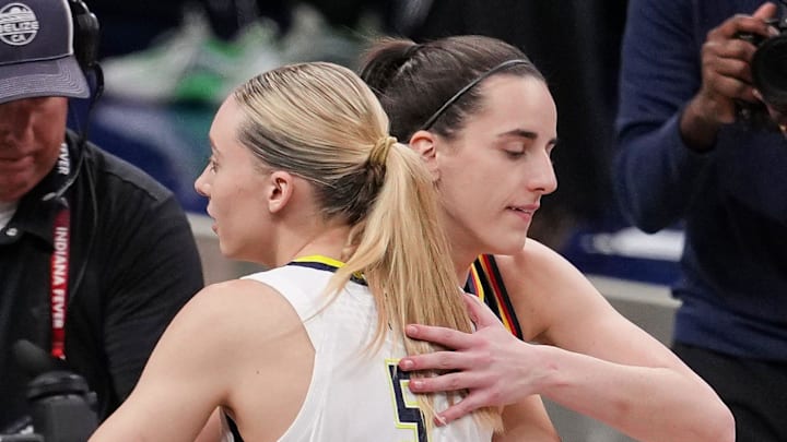 Indiana Fever guard Caitlin Clark (22) and Dallas Wings guard Paige Bueckers (5) hug Sunday, July 13, 2025, ahead of the game at Gainbridge Fieldhouse in Indianapolis.