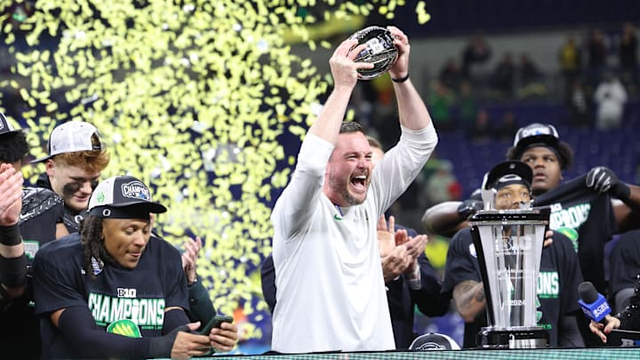 Dec 7, 2024; Indianapolis, IN, USA; Oregon Ducks head coach Dan Lanning and the Oregon Ducks celebrate defeating the Penn State Nittany Lions to win the Big Ten Championship in the 2024 Big Ten Championship game at Lucas Oil Stadium. Mandatory Credit: Jordan Prather-Imagn Images