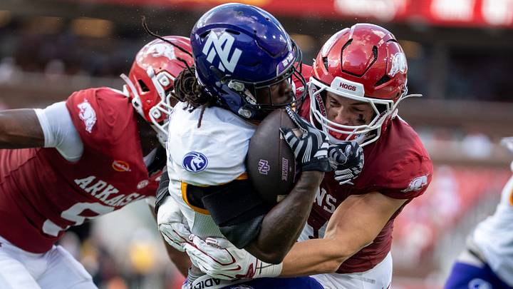 Arkansas Razorbacks linebacker Ben Bogle tackles a UNA offensive player during the season opener. Arkansas Razorbacks linebacker Ben Bogle tackles a UNA offensive player during the season opener.