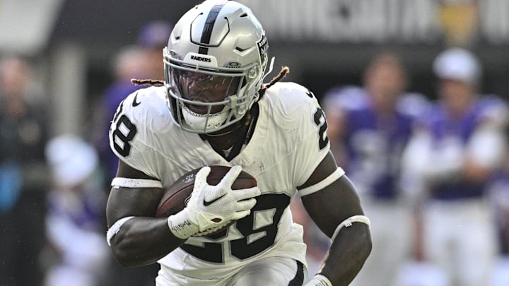 Aug 10, 2024; Minneapolis, Minnesota, USA; Las Vegas Raiders running back Sincere McCormick (28) runs the ball against the Minnesota Vikings during the third quarter at U.S. Bank Stadium. Mandatory Credit: Jeffrey Becker-Imagn Images