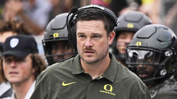 Sep 17, 2022; Eugene, Oregon, USA; Oregon Ducks head coach Dan Lanning watches the game from the sidelines during the first half against the Brigham Young Cougars at Autzen Stadium. Oregon won the game 41-20. Mandatory Credit: Troy Wayrynen-Imagn Images Sep 17, 2022; Eugene, Oregon, USA; Oregon Ducks head coach Dan Lanning watches the game from the sidelines during the first half against the Brigham Young Cougars at Autzen Stadium. Oregon won the game 41-20. Mandatory Credit: Troy Wayrynen-Imagn Images