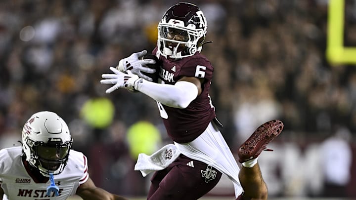 Nov 16, 2024; College Station, Texas, USA; New Mexico State Aggies safety Tayden Barnes (3) and safety Nick Session (5) tackle Texas A&M Aggies wide receiver Cyrus Allen (6) during the first half at Kyle Field. Mandatory Credit: Maria Lysaker-Imagn Images Nov 16, 2024; College Station, Texas, USA; New Mexico State Aggies safety Tayden Barnes (3) and safety Nick Session (5) tackle Texas A&M Aggies wide receiver Cyrus Allen (6) during the first half at Kyle Field. Mandatory Credit: Maria Lysaker-Imagn Images
